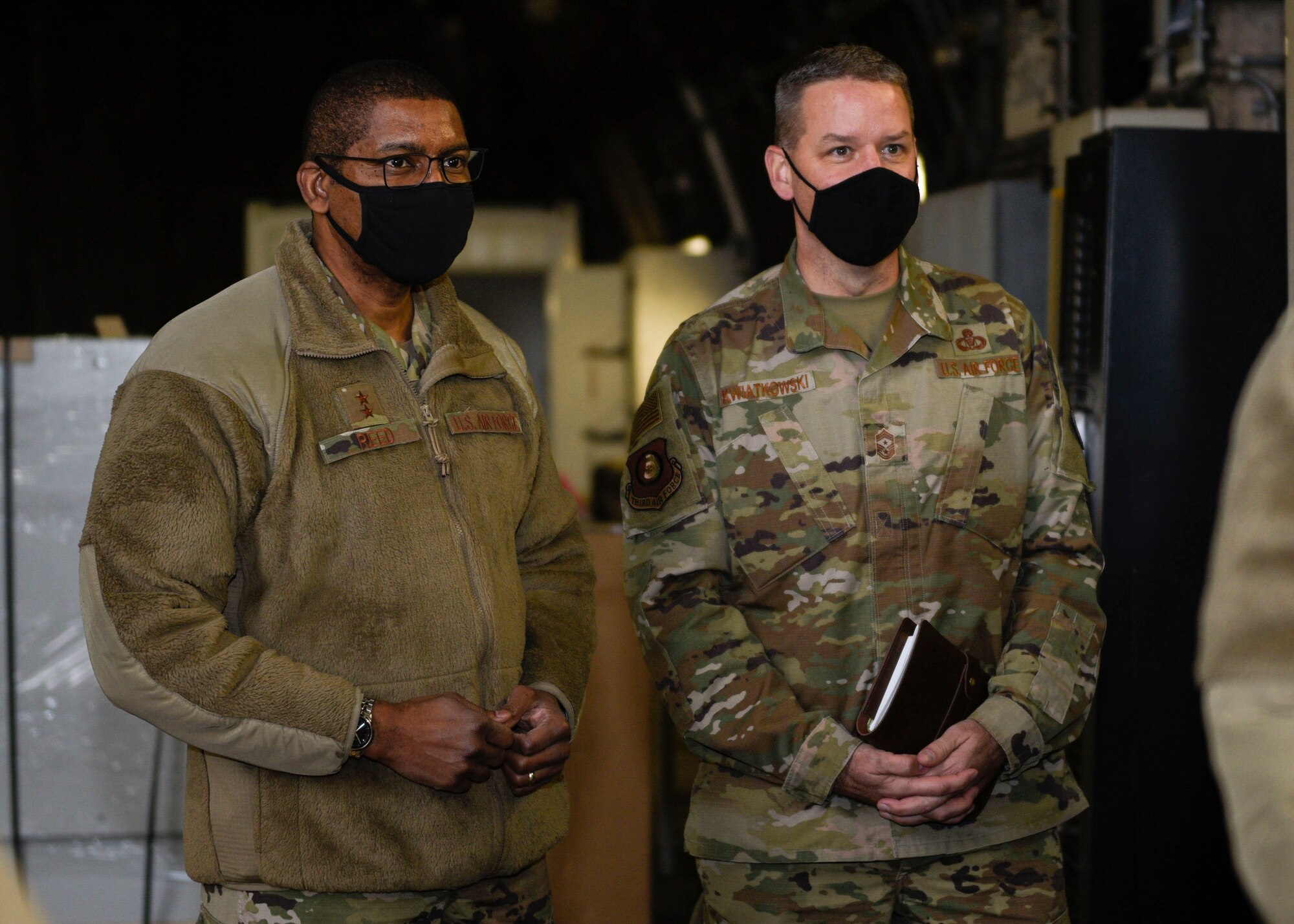 U.S. Air Force Maj. Gen. Randall Reed, Third Air Force commander, left, and Chief Master Sgt. Randy Kwiatkowski, Third Air Force command chief, listen to briefs in a protective aircraft shelter, Dec. 7, 2020, at Spangdahlem Air Base, Germany. Reed and Kwiatkowski were able to see the different PAS capabilities, challenges and renovation program in place, as well as see how the 52nd FW Airmen were maintaining their capabilities. (U.S. Air Force photo by Senior Airman Melody W. Howley)