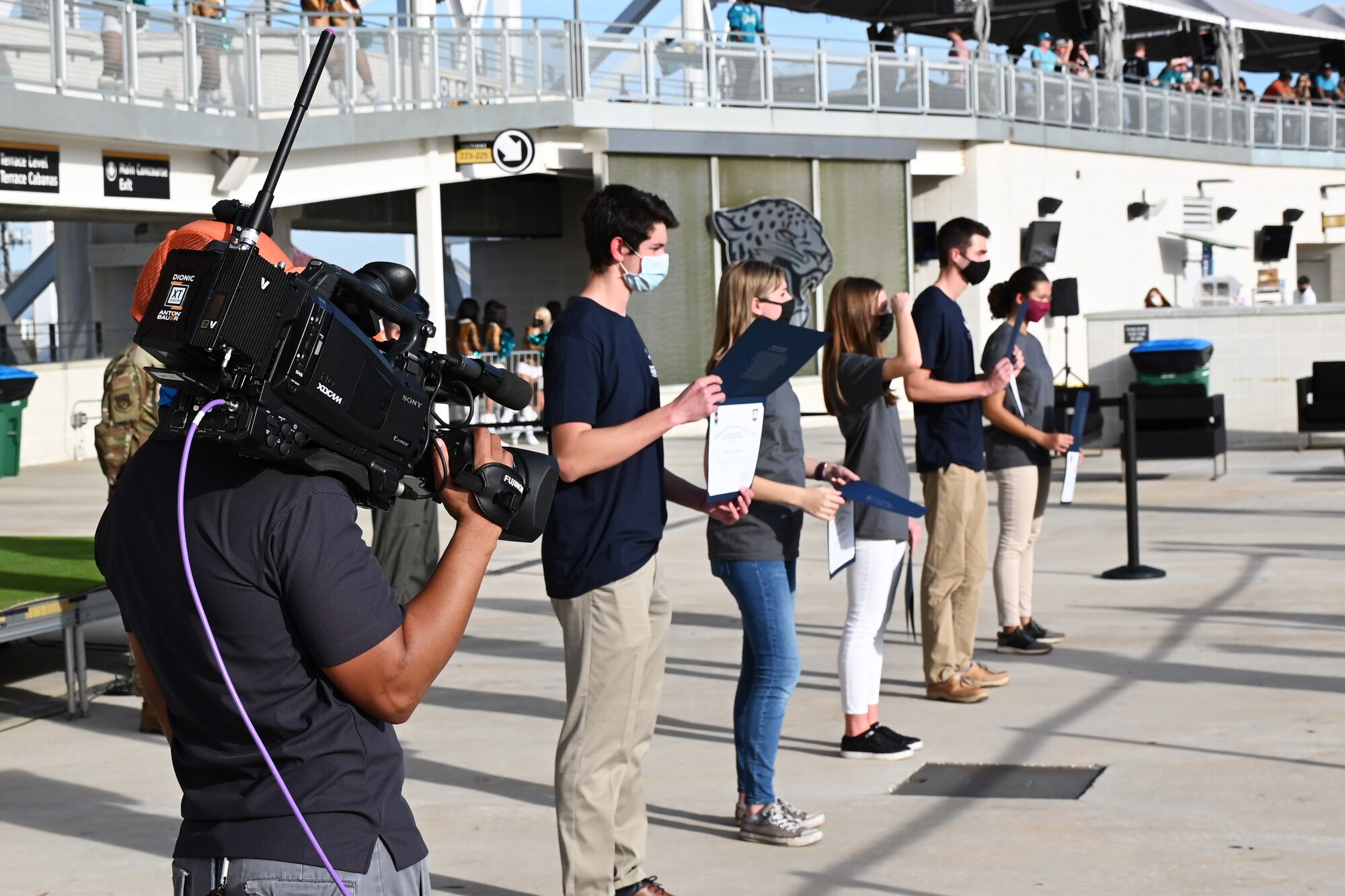 Five high school students are recognized and presented with their ROTC scholarship certificates at TIAA Bank Stadium in Jacksonville, Florida, Dec. 11, 2020. The certificates were presented during the fourth quarter of the Jacksonville Jaguars game. (U.S. Air Force photo by Senior Airman Heather LeVeille)