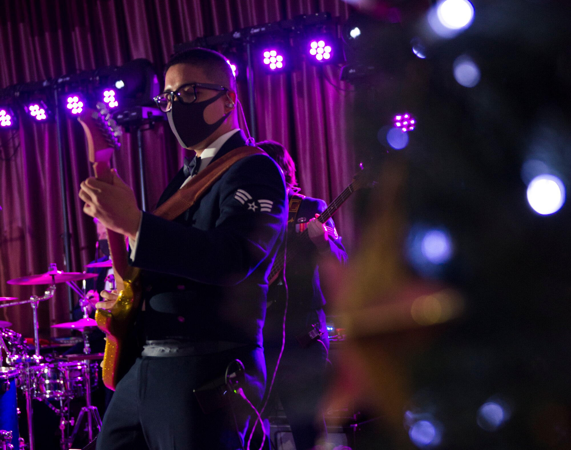 Senior Airman Ryu Yamakawa, U.S. Air Force Band of the Pacific guitarist, plays guitar during the Sounds of the Season show on Yokota Air Base, Japan, Dec. 15, 2020. The holiday show was the band’s first live performance in nine months. (U.S. Air Force photo by Staff Sgt. Joshua Edwards)