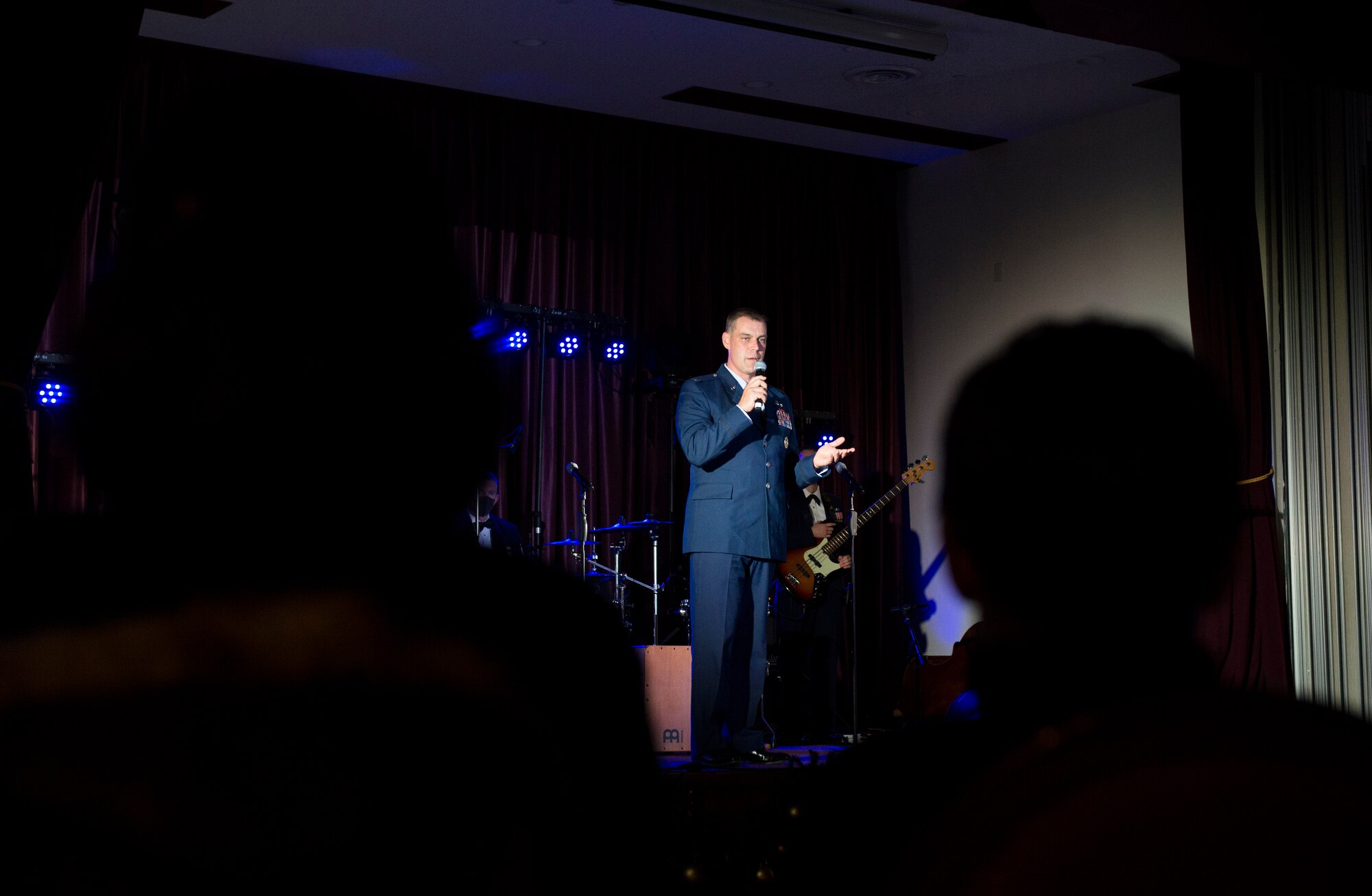 Col. Andrew Campbell, 374th Airlift Wing commander, speaks during the Air Force Band of the Pacific’s Sounds of the Season show on Yokota Air Base, Japan, Dec. 15, 2020. Campbell spoke on Yokota’s role in the 69th annual Operation Christmas Drop and introduced a video showing bundle drops with an original score by the band. (U.S. Air Force photo by Staff Sgt. Joshua Edwards)