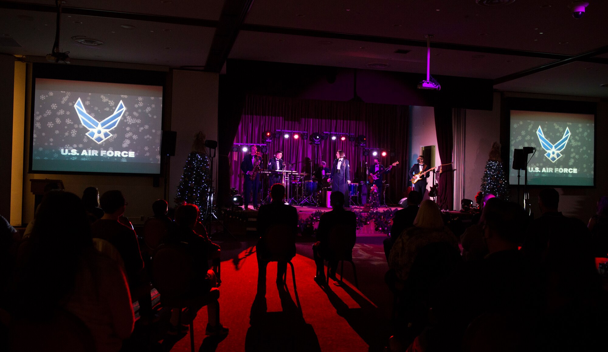 Audience members watch as the Air Force Band of the Pacific plays their Sounds of the Season show on Yokota Air Base, Japan, Dec. 15, 2020. The band performed holiday classics, with a modern twist. (U.S. Air Force photo by Staff Sgt. Joshua Edwards)