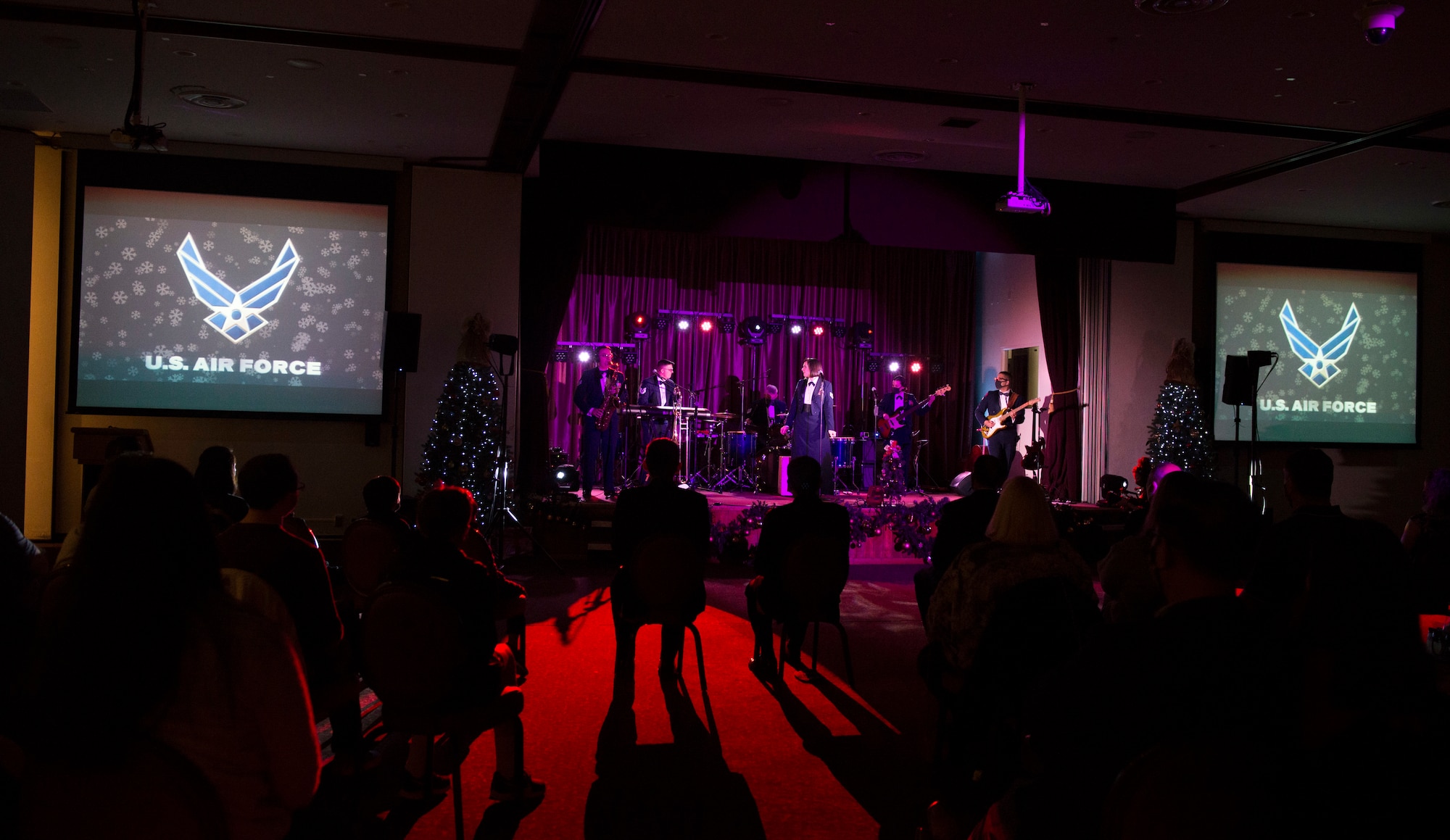 Audience members watch as the Air Force Band of the Pacific plays their Sounds of the Season show on Yokota Air Base, Japan, Dec. 15, 2020. The band performed holiday classics, with a modern twist. (U.S. Air Force photo by Staff Sgt. Joshua Edwards)