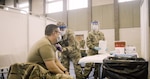 Approximately 200 Indiana National Guard Soldiers and Airmen received the COVID vaccination on Dec. 16, 2020, at the Johnson County Armory in Frankllin, Ind. The Guard members have been on the front lines of the fight against the coronavirus, working at nursing homes, food banks and elsewhere.