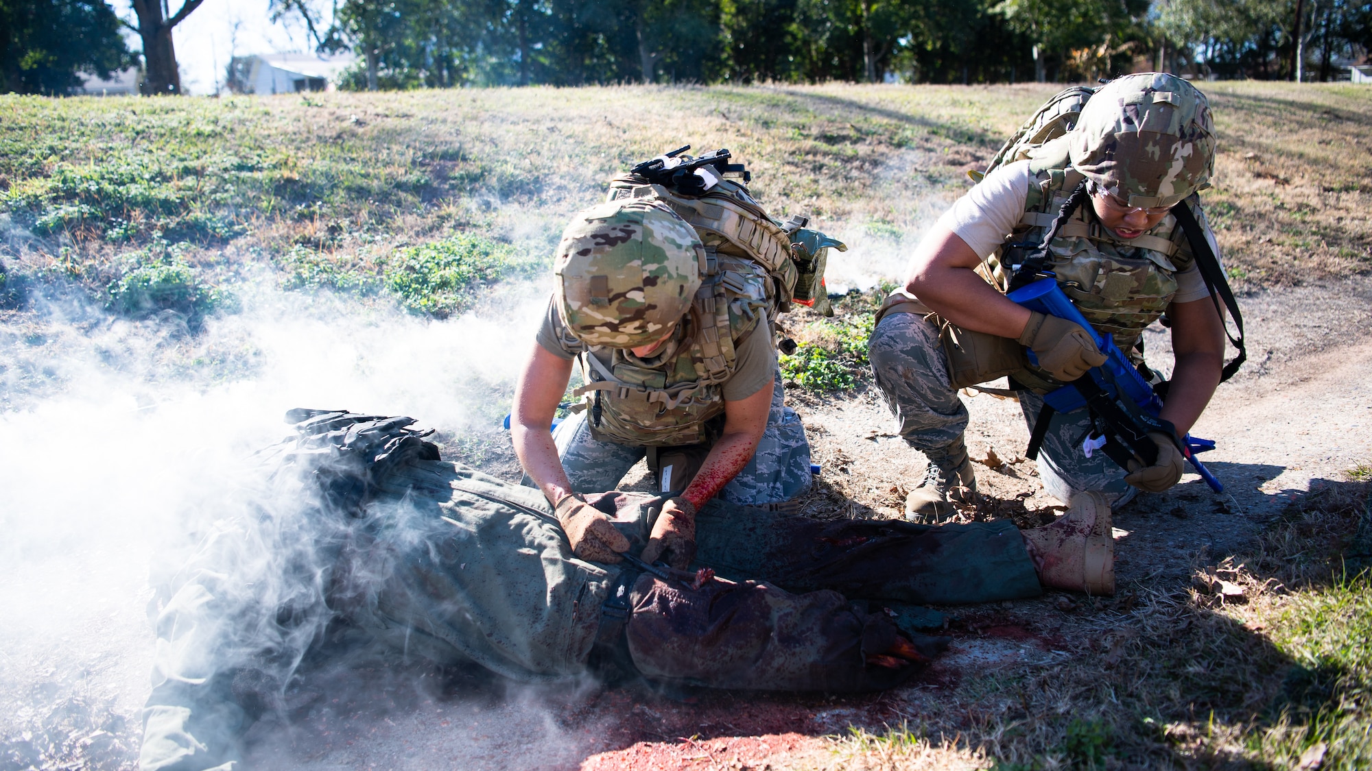 Staff Sgt. Johanna Esquivel, 2nd Operational Medical Readiness Squadron medical technician, and Staff Sgt. Jelisa Adams, 2nd Healthcare Operations Squadron medical technician, provide tactical field care to a training dummy during a Tactical Combat Casualty Care (TCCC) class at Barksdale Air Force Base, La., Dec. 9, 2020.