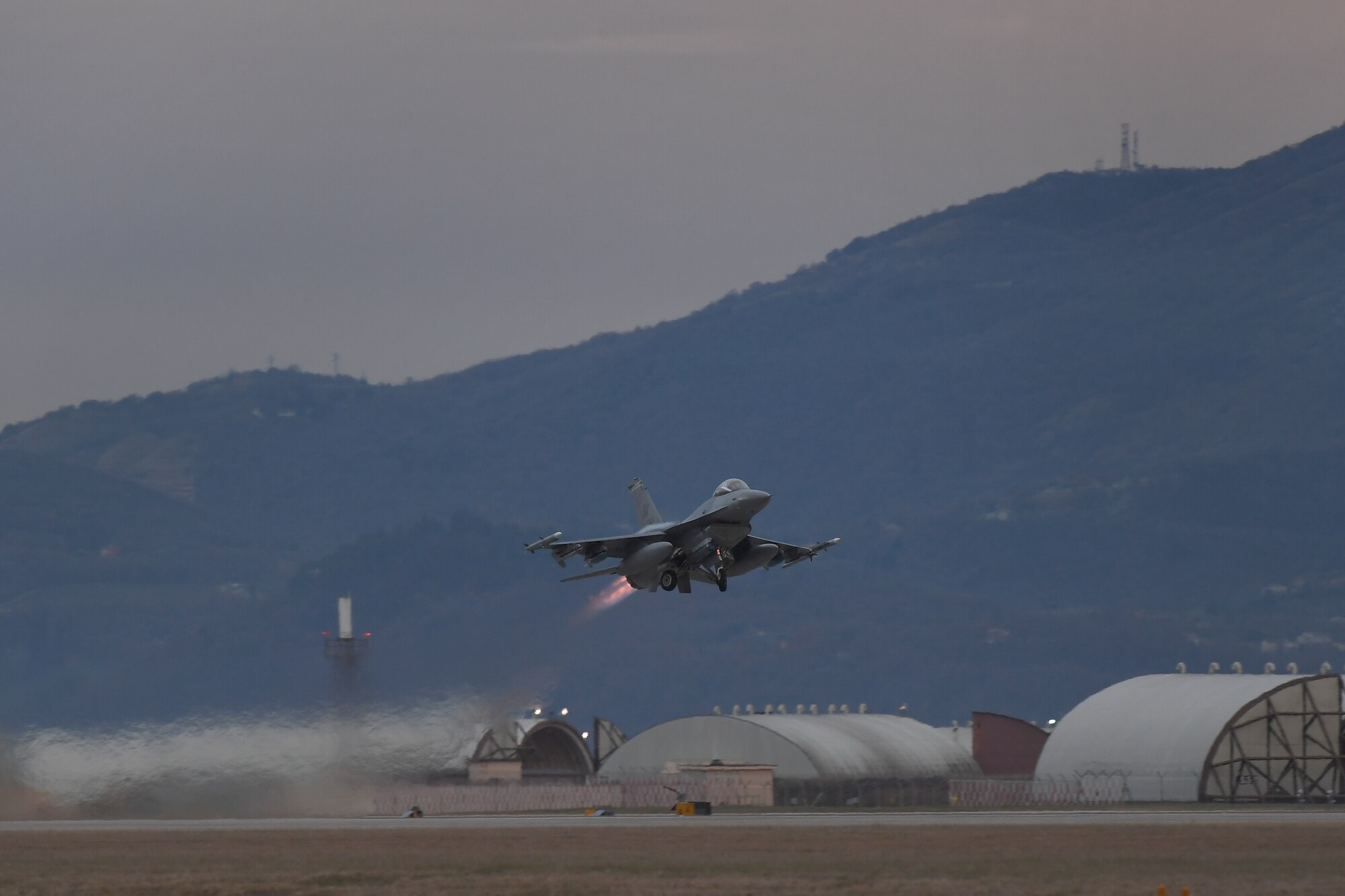 A U.S. Air Force F-16 Fighting Falcon assigned to the 555th Fighter Squadron takes off from Aviano Air Base, Italy, Dec. 16, 2020, during an Agile Combat Employment exercise. The F-16s executed close air support at Rivolto Air Base, Italy. Airmen from the 31st Maintenance Group and 31st Civil Engineer Squadron also worked on the aircraft with Italian counterparts from the 2nd Wing of the Italian air force. (U.S. Air Force photo by Staff Sgt. Valerie Halbert)