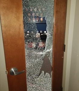 A door with glass damage