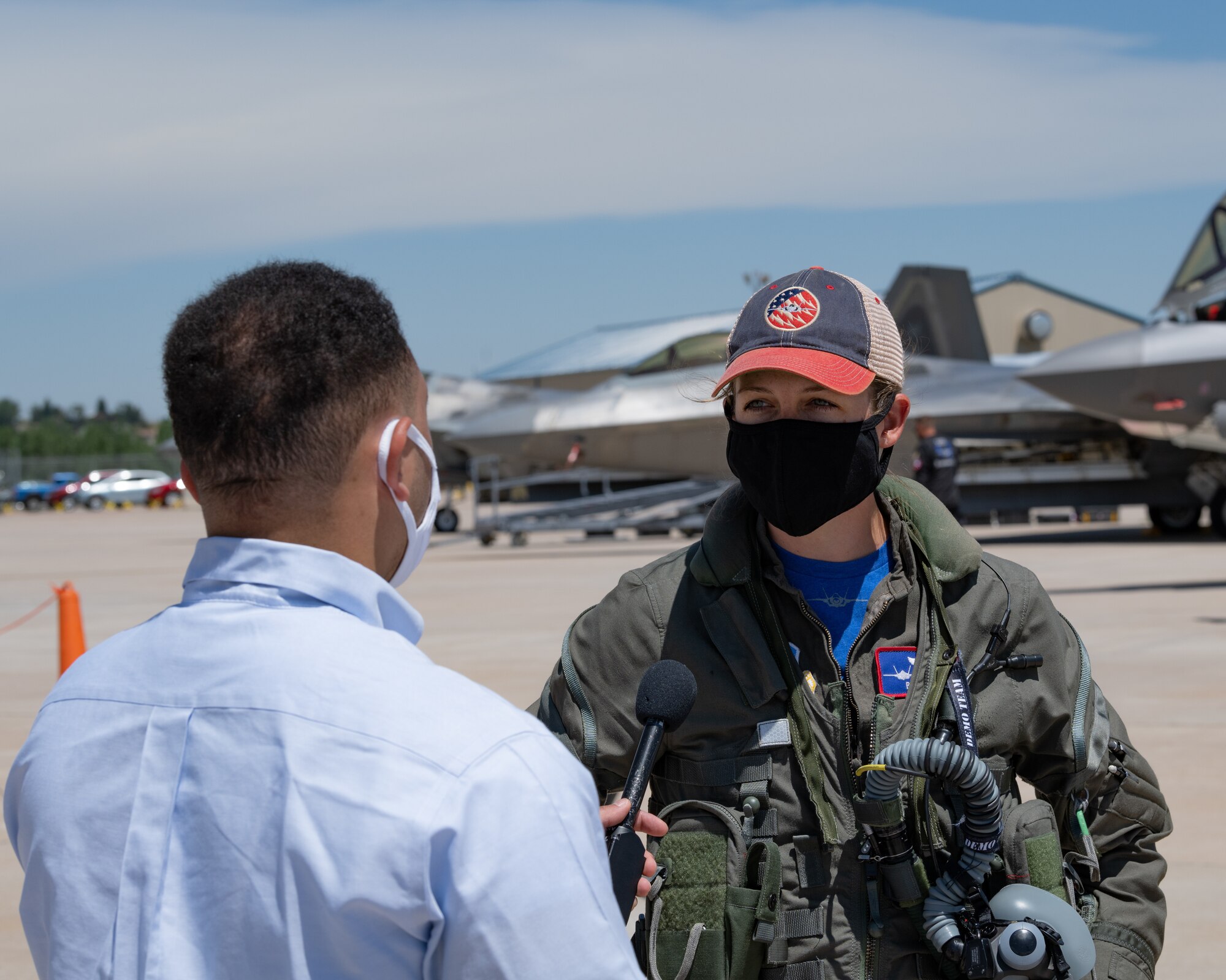 The F-35A Lightning II Demonstration Team pilot and commander, Capt. Kristin "BEO" Wolfe speaks with a member of Washington State media.