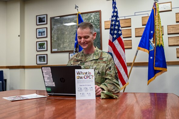 A person looking at a computer.
