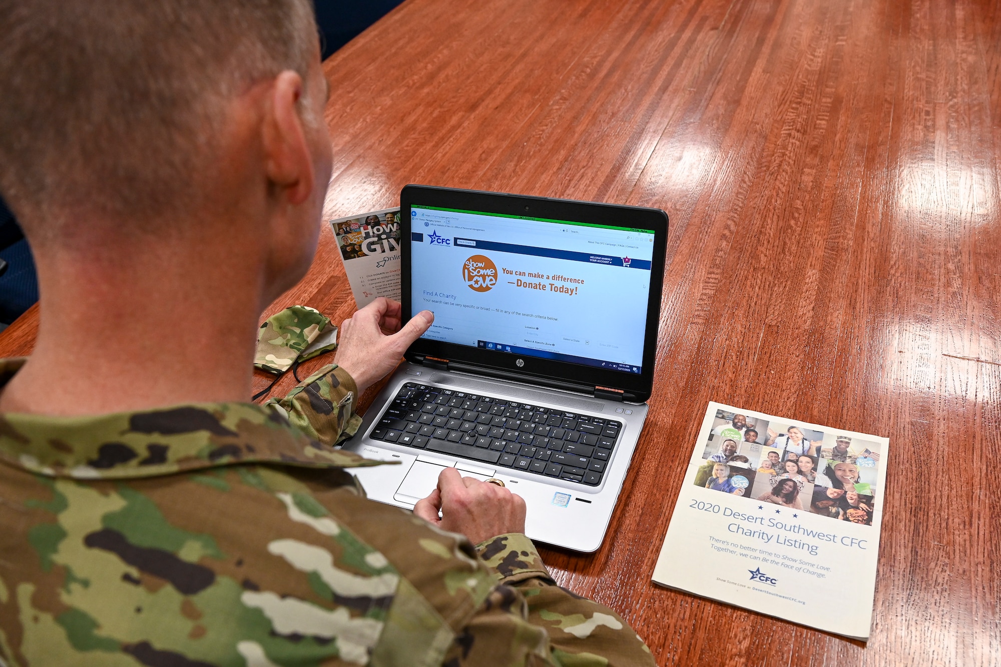 A person looking at a computer.