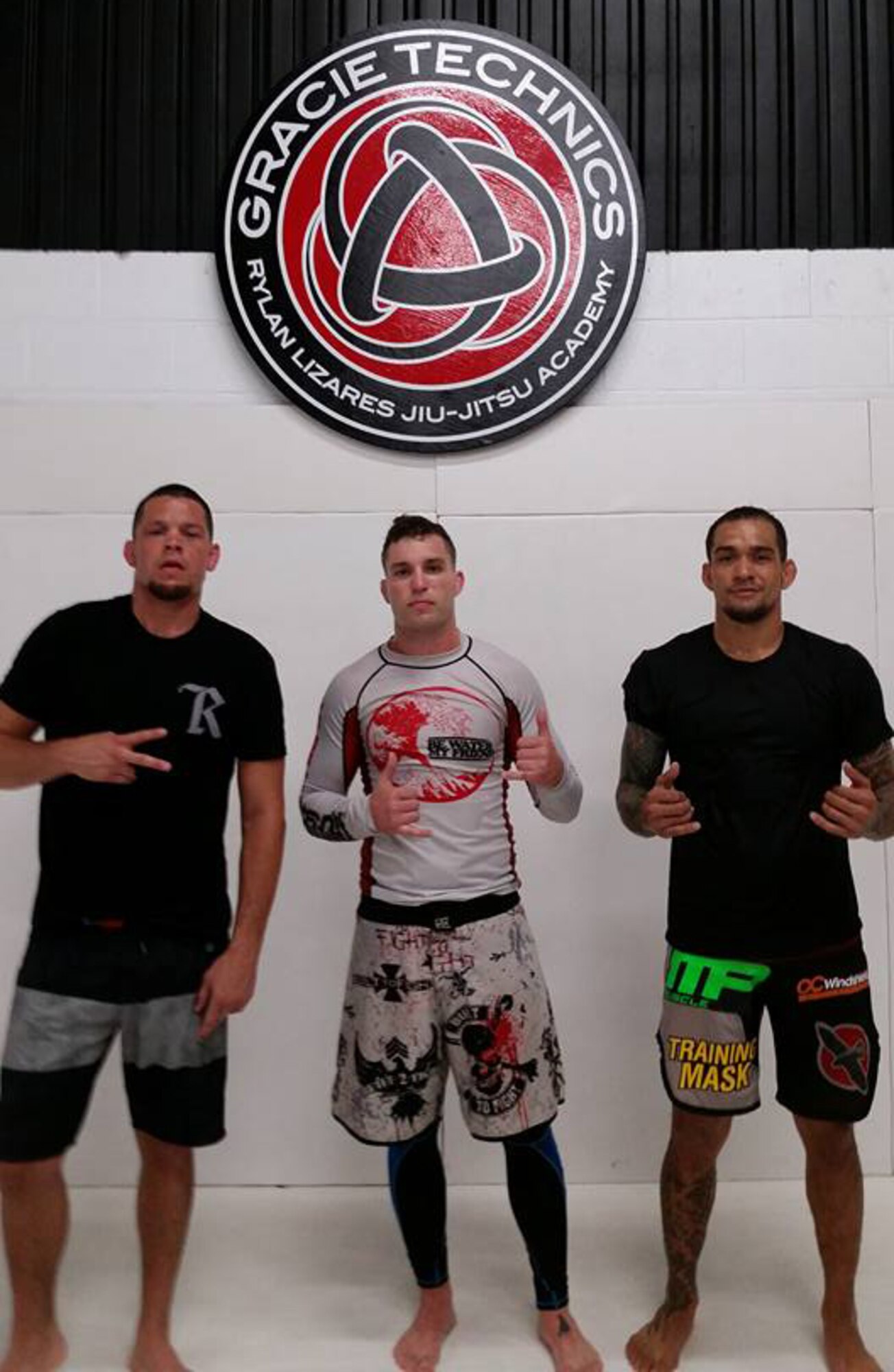 Master Sgt. Kyle Atkinson (middle), an enlisted accessions recruiter with the 341st Recruiting Squadron, Katy, Texas, pictured with Ultimate Fighting Championship fighters Nate Diaz and Yancy Mederos at a practice at the Gracie Technics Brazilian Jiu Jitsu School in Honolulu, Hawaii.