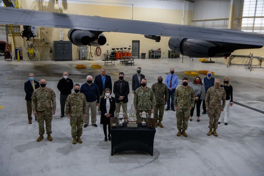 Team Minot Civic Leaders pose for the Omaha Trophy Dec. 15, 2020, at Minot Air Force Base, North Dakota. Rear Adm. William W. Wheeler III, U.S. Strategic Command Chief of Staff, visited Team Minot to present the Omaha Trophy to both the 91st Missile Wing and the 5th Bomb Wing. (U.S. Air Force photo by Airman 1st Class Jesse Jenny)