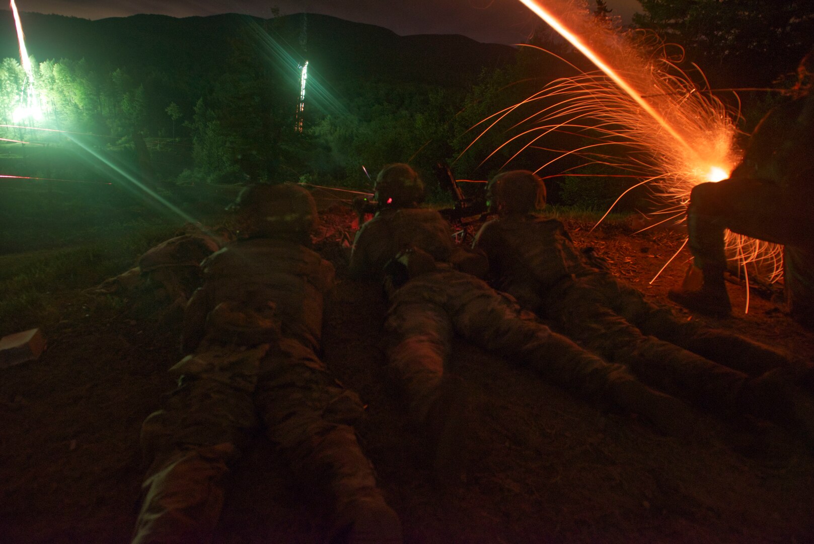 U.S. Army Soldiers with Bravo Company, 3rd Battalion, 172nd Infantry Regiment, 86th Infantry Brigade Combat Team (Mountain), Maine Army National Guard, establish a support by fire position during a nighttime live-fire training lane, Ethan Allen Firing Range, Jericho, Vermont, July 20, 2020. The live-fire range was conducted as part of their annual training and included multiple assault elements, support by fire positions and door breaches. (U.S. Army National Guard Photo by 2nd Lt. Nathan Rivard)