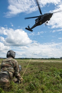 Soldiers with Charlie Company, 3rd Battalion, 126th Aviation Regiment, 86th Troop Command, Garrison Support Command, Vermont National Guard, performed hoist training with UH-60 Black Hawk helicopters over Camp Johnson in Colchester, Vermont, Aug. 7, 2020. The Soldiers were conducting training as part of their annual training. (Photo by U.S. Army National Guard 2nd Lt. Nathan Rivard)