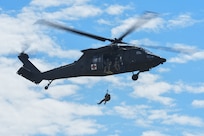 Soldiers with Charlie Company, 3rd Battalion, 126th Aviation Regiment, 86th Troop Command, Garrison Support Command, Vermont National Guard, performed hoist training with UH-60 Black Hawk helicopters over Camp Johnson in Colchester, Vermont, Aug. 7, 2020. The Soldiers were conducting training as part of their annual training. (Photo by U.S. Army National Guard 2nd Lt. Nathan Rivard)