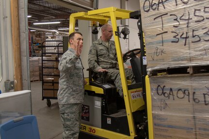 Airmen assigned to the 158th Logistics Readiness Squadron, Vermont Air National Guard, assist Vermont Health Department workers prepare medical equipment for redistribution March 31, 2020. The equipment includes surgical masks and gowns, respirators, and other assorted safety gear that will be sent to hospitals, and emergency services all over Vermont. (Photo by U.S. Army National Guard Sgt. 1st Class Jason Alvarez)