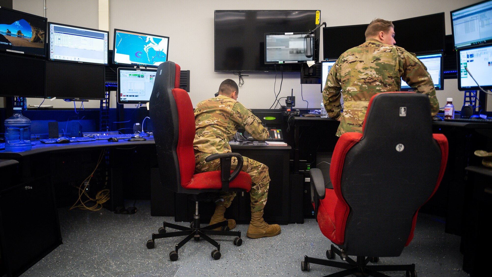 Airmen from the 2nd Civil Engineer Squadron fire department answer phones and coordinate search and rescue efforts after a civilian light aircraft crash at Barksdale Air Force Base, La., Dec.16, 2020. Airmen from the 2nd SFS, 2nd Civil Engineer Squadron, 2nd Medical Group, 2nd Logistics Readiness Squadron and local authorities worked in conjunction to locate and effectively respond to a civilian light aircraft crash on the east side of Barksdale. (U.S. Air Force photo by Senior Airman Lillian Miller)