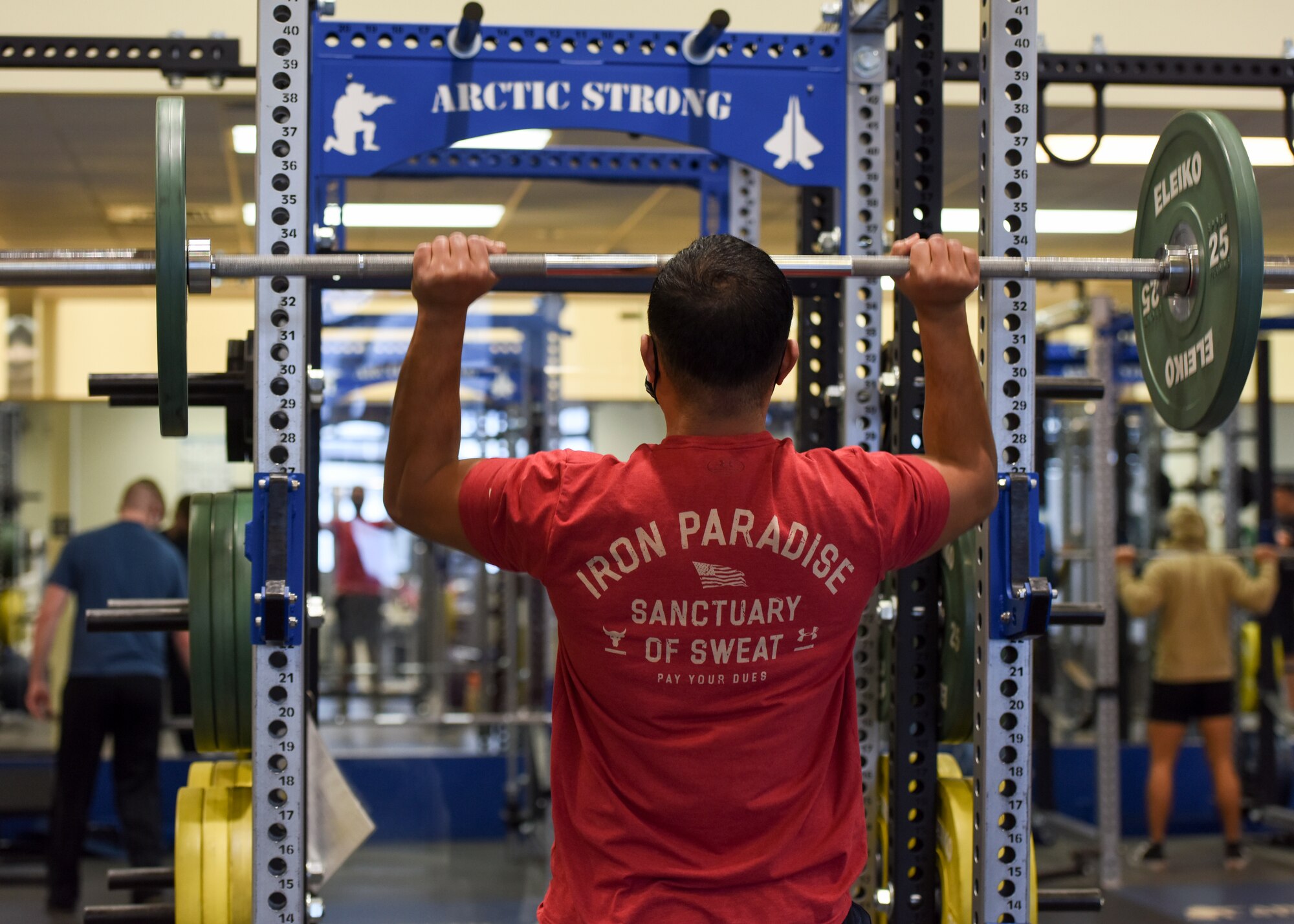 U.S. Army Chief Warrant Officer 3 James Salavea, officer in charge of geospatial intelligence 
assigned to the 4th Infantry Brigade Combat Team (Airborne), 25th Infantry division, U.S. Army Alaska, lifts weights during a workout at the Elmendorf Fitness Center on Joint Base Elmendorf-Richardson, Alaska, Dec 14, 2020. In addition to state-of-the-art equipment the center also includes specialized work out rooms, basketball courts, an indoor running track and an abundance of new strength and cardio machines. (U.S. Air Force photo by Senior Airman Crystal A. Jenkins)