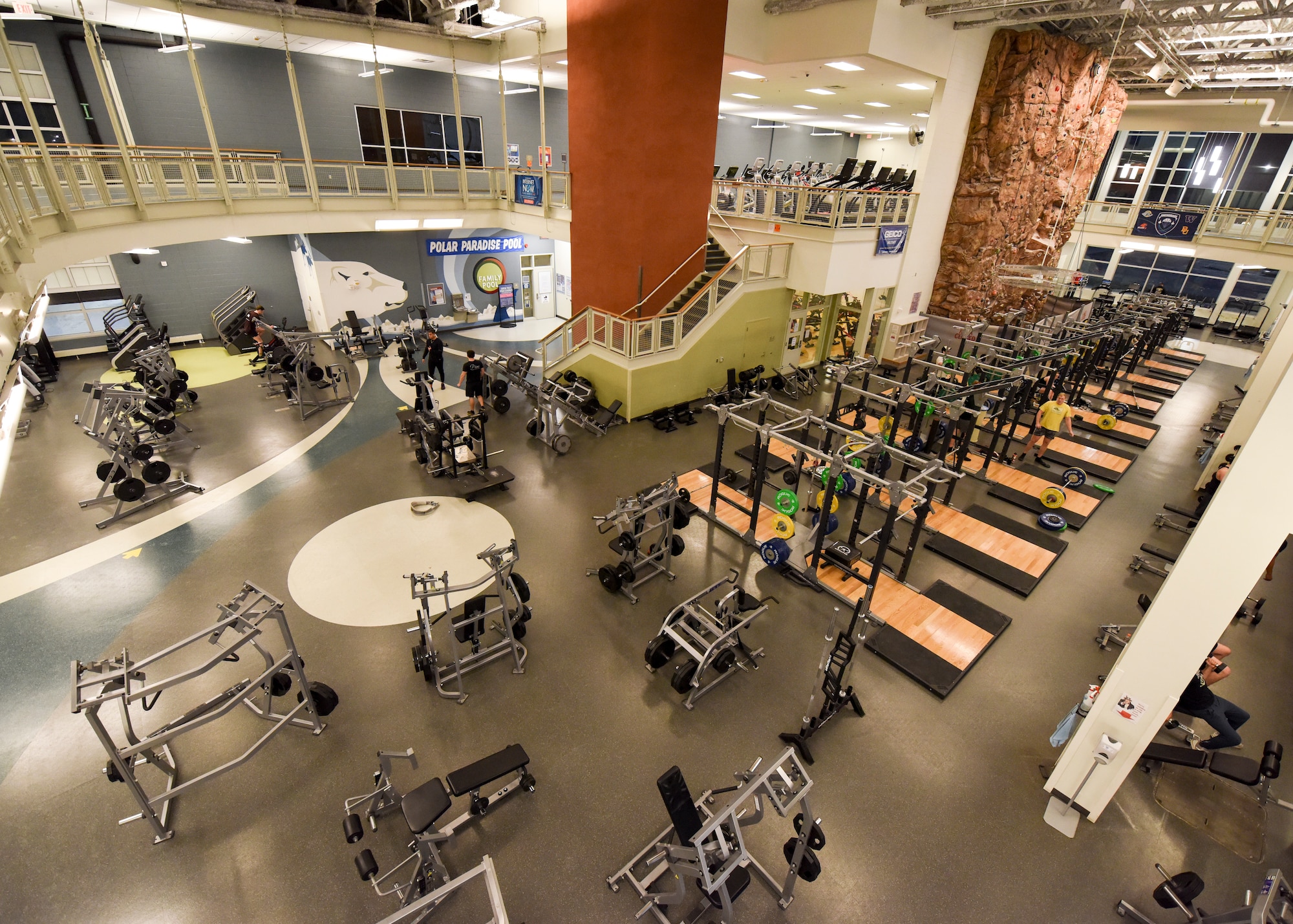 An indoor running track, aerobic machines, free weights and a rock-climbing wall sit ready for use at the Buckner Fitness Center on Joint Base Elmendorf-Richardson, Alaska, Dec 14, 2020. In addition to the 35,000 square-foot state-of-the-art fitness area, Buckner also includes an aquatic center, fitness pool, and an abundance of new strength and cardio machines. (U.S. Air Force photo by Senior Airman Crystal A. Jenkins)