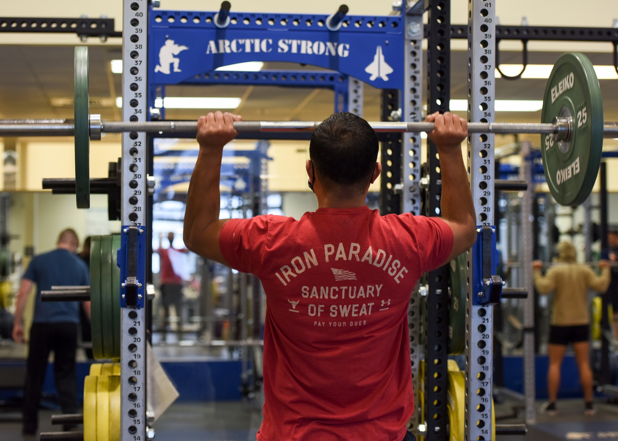 U.S. Army Chief Warrant Officer 3 James Salavea, officer in charge of geospatial intelligence 
assigned to the 4th Infantry Brigade Combat Team (Airborne), 25th Infantry division, U.S. Army Alaska, lifts weights during a workout at the Elmendorf Fitness Center on Joint Base Elmendorf-Richardson, Alaska, Dec 14, 2020. In addition to state-of-the-art equipment the center also includes specialized work out rooms, basketball courts, an indoor running track and an abundance of new strength and cardio machines. (U.S. Air Force photo by Senior Airman Crystal A. Jenkins)