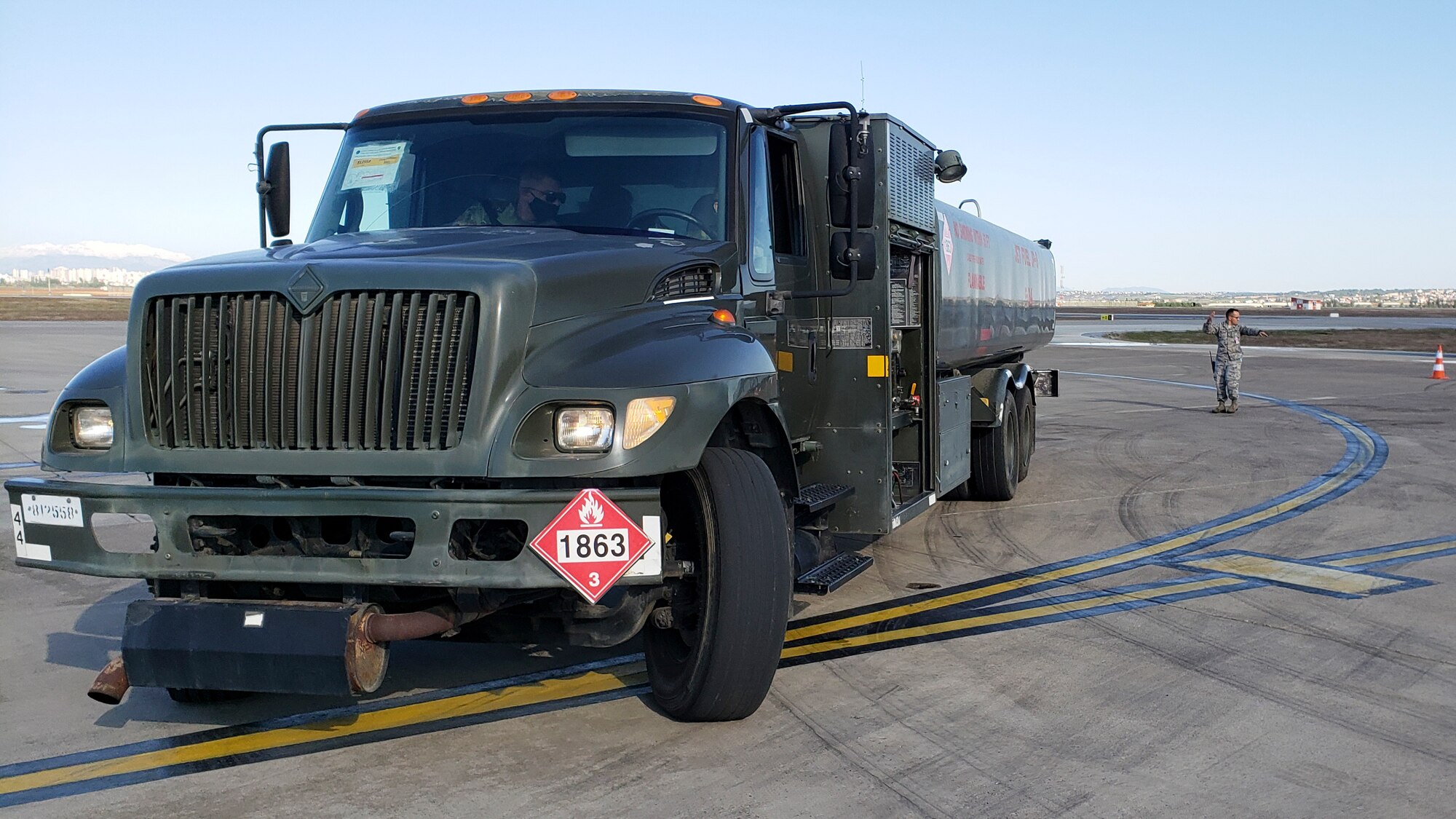 a fuel truck sits on the flight line