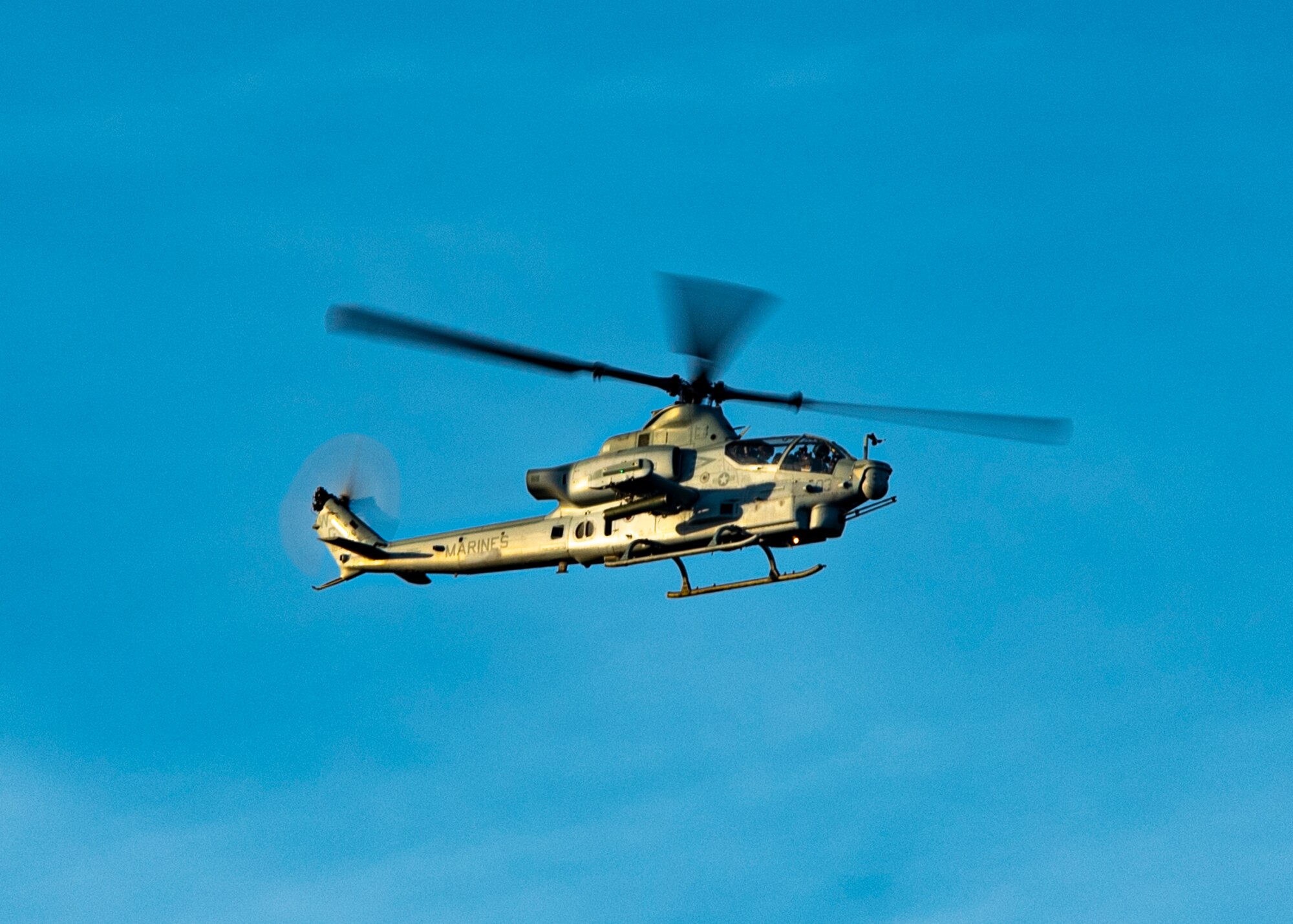 A helicopter flies in the sky.