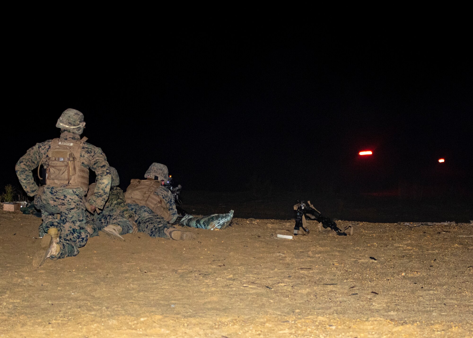 Marines conduct night time machine-gun training.