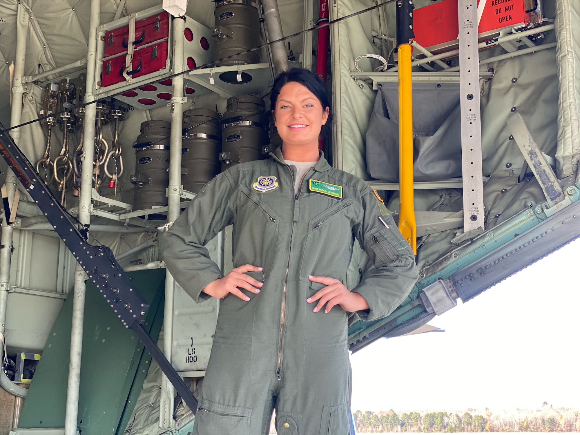 A loadmaster stands on the ramp of a C-130J Super Hercules.
