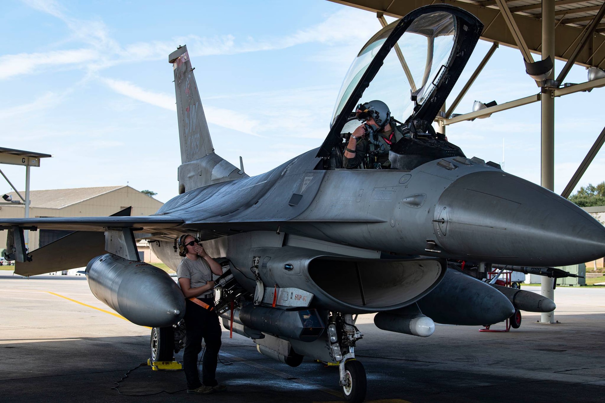 photo of Airmen and F16