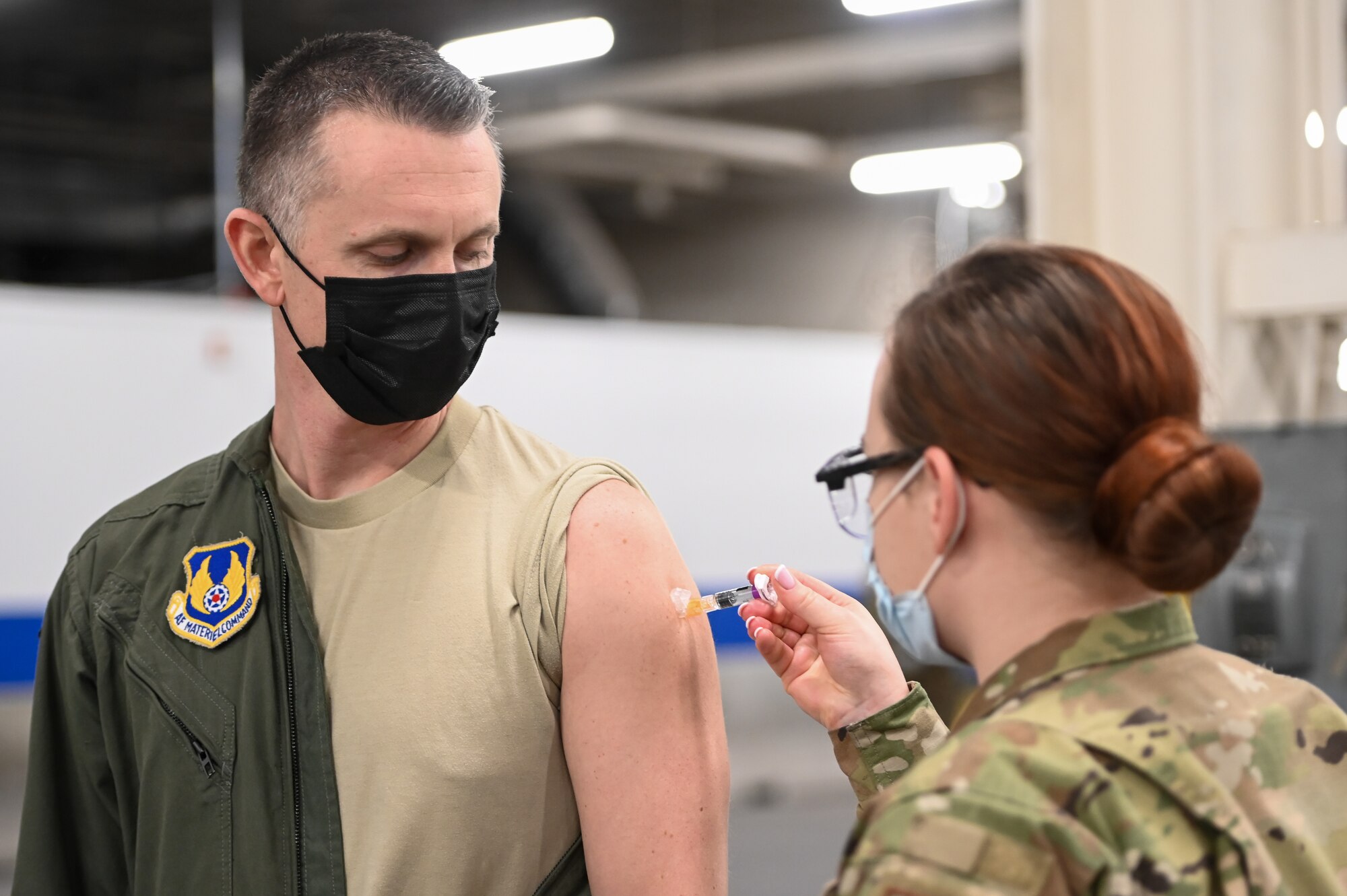 Lt. Col. David Isaksen, Ogden Air Logistics Complex, receives a flu vaccination shot Dec. 17, 2020, at Hill Air Force Base, Utah, from Airman 1st Class Sofia Fitzgerald, 75th Medical Group. The CDC recommends seasonal influenza vaccine for all people 6 months of age and older. The best way to prevent seasonal flu is to get vaccinated every year. (U.S. Air Force photo by Cynthia Griggs)