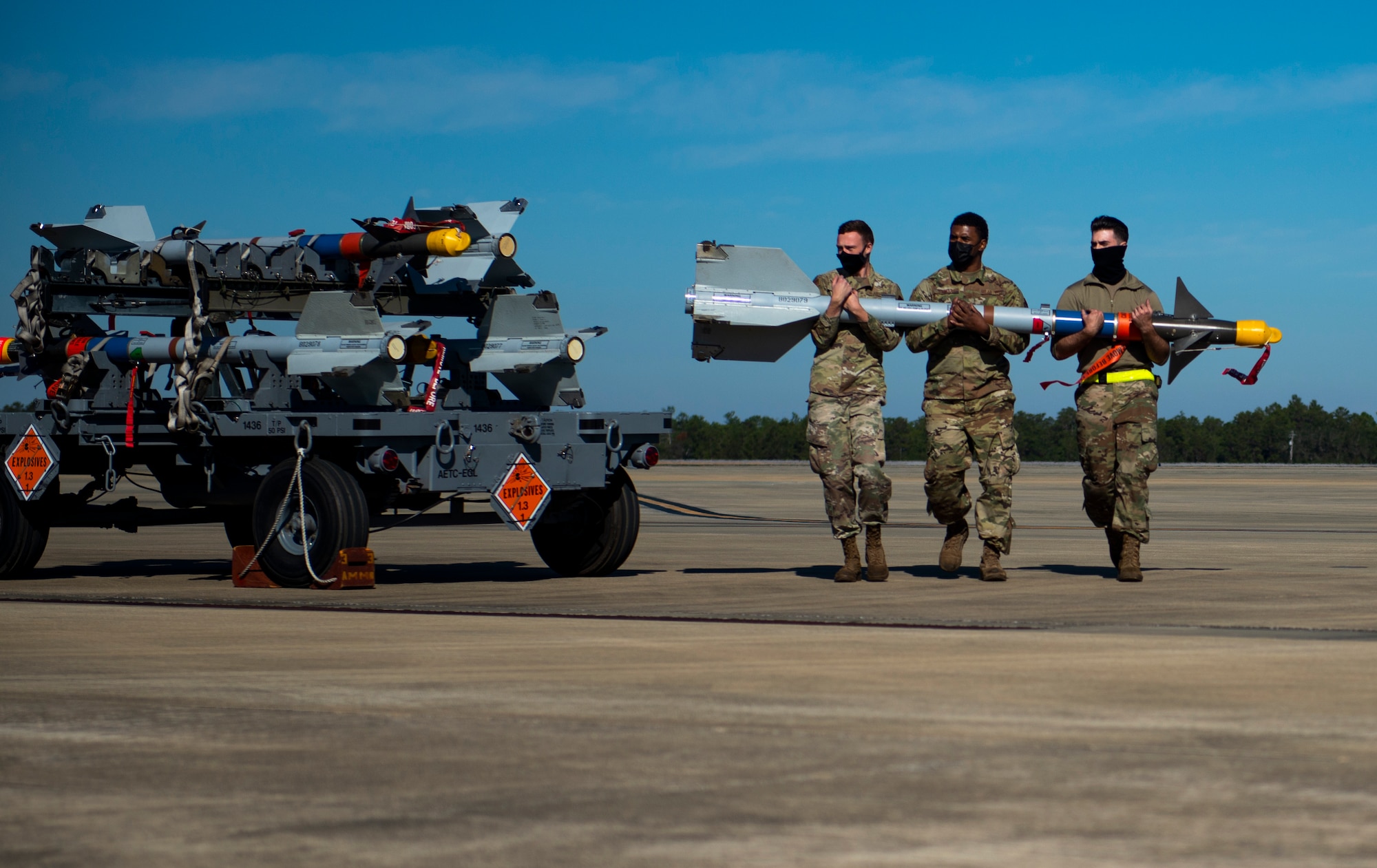 men carry a missile