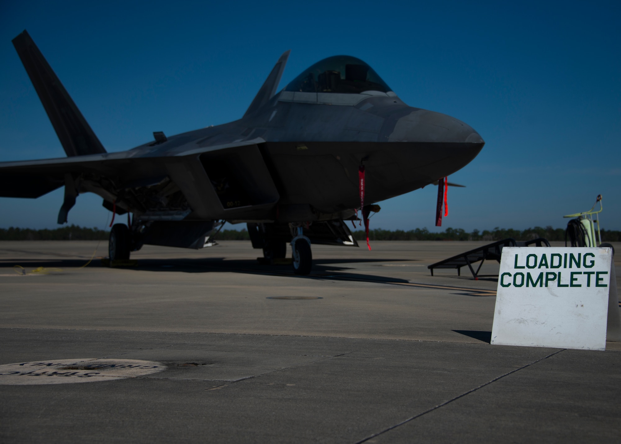 airplane with loading complete sign in foreground