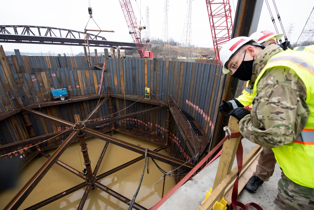 Maj. Gen. William (Butch) H. Graham, U.S. Army Corps of Engineers commanding general for Civil and Emergency Operations, overlooks ongoing construction of a cofferdam cell by a Johnson Brothers work crew at the Kentucky Lock Addition Project Dec. 16, 2020 at Grand Rivers, Kentucky, where the U.S. Army Corps of Engineers Nashville District is constructing the new 110-foot by 1,200-foot navigation lock at the Tennessee Valley Authority project. (USA CE Photo by Lee Roberts)