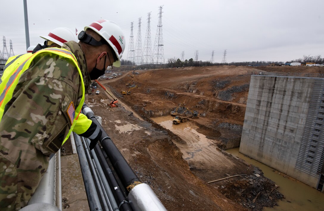 Maj. Gen. William (Butch) H. Graham, U.S. Army Corps of Engineers commanding general for Civil and Emergency Operations, overlooks Heeter Geotechnical Construction crews excavating dirt and rock at the Kentucky Lock Addition Project Dec. 16, 2020 at Grand Rivers, Kentucky, where the U.S. Army Corps of Engineers Nashville District is constructing the new 110-foot by 1,200-foot navigation lock at the Tennessee Valley Authority project. (USACE Photo by Lee Roberts)