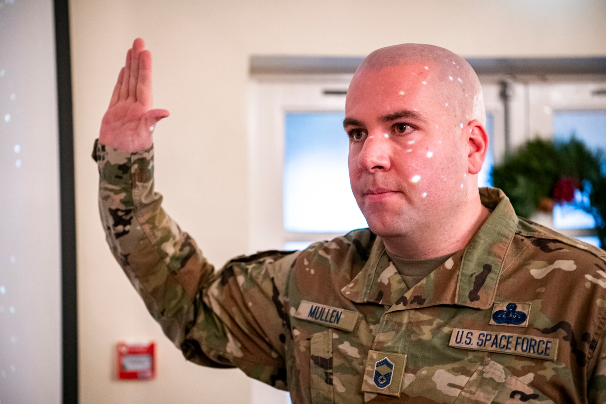 U.S. Air Force Senior Master Sgt. Kyle Mullen, 423rd Communications Squadron superintendent, takes the oath of enlistment to transition into the United States Space Force at RAF Alconbury, England, Dec. 18, 2020. Mullen became the first Airman from the 501st Combat Support Wing to transition into the USSF. (U.S. Air Force photo by Senior Airman Eugene Oliver)