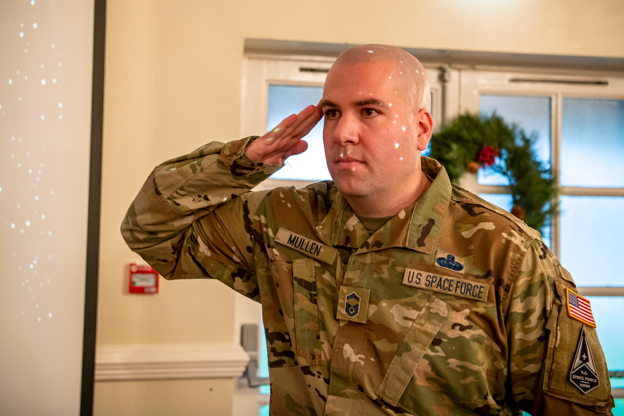 U.S. Air Force Senior Master Sgt. Kyle Mullen, 423rd Communications Squadron superintendent, salutes after taking the oath of enlistment to transition into the United States Space Force at RAF Alconbury, England, Dec. 18, 2020. Mullen became the first Airman from the 501st Combat Support Wing to transition into the USSF. (U.S. Air Force photo by Senior Airman Eugene Oliver)