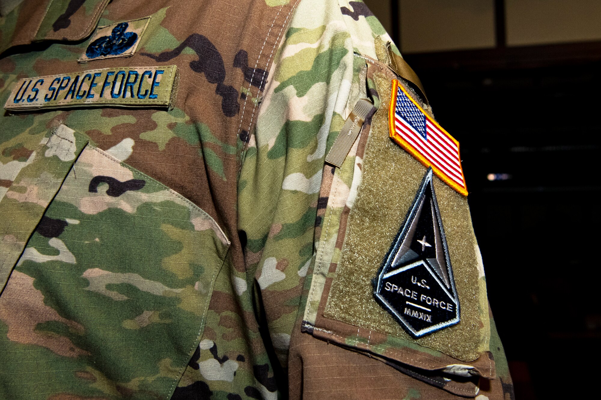 A United States Space Force patch rests on the arm of Senior Master Sgt. Kyle Mullen, right, 423rd Communications Squadron superintendent, at RAF Alconbury, England, Dec. 18, 2020. Mullen became the first Airman from the 501st Combat Support Wing to transition into the USSF. (U.S. Air Force photo by Senior Airman Eugene Oliver)