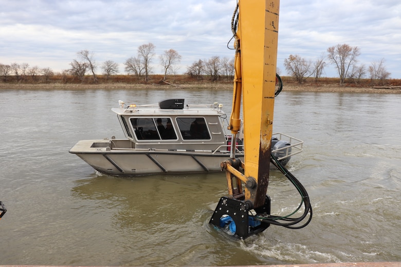 A Kansas City District work boat performs river bottom surveys while taking part in hydrodynamic dredging operations on the Missouri River November 11, 2020. The Engineering Research and Development Center brought the system to Kansas City District from Vicksburg, Miss., to assist in clearing shoals that developed on the Missouri River due to damages from flooding to the river control structures. The device enabled the combined team to redirect sandy material back into suspension in the current of the river and away from the built-up areas that impede navigation on the river.