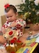 A baby plays with toy bears