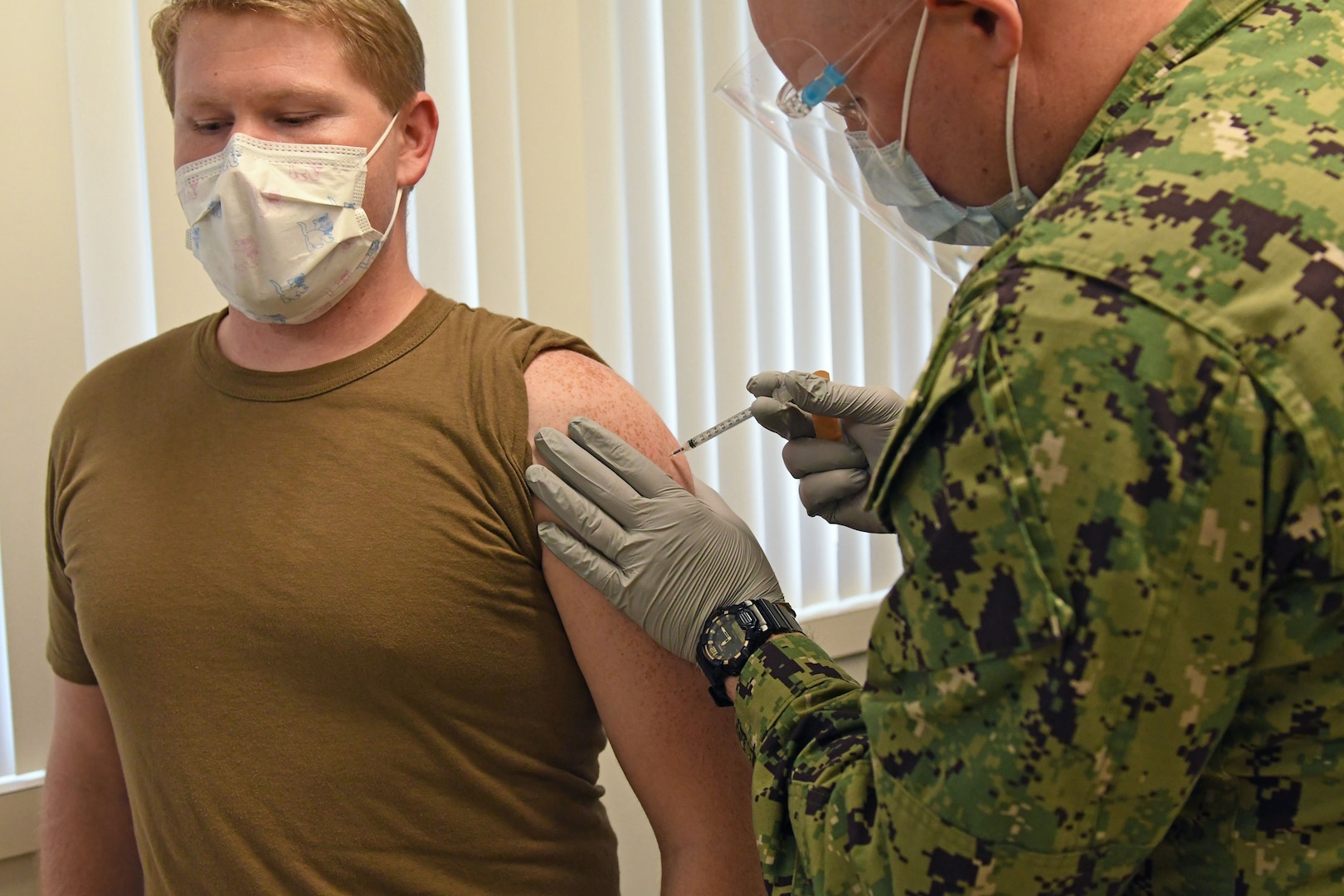 Sailor receives COVID-19 vaccine.