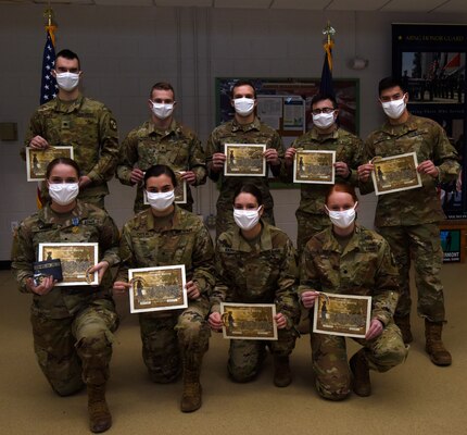 University of Vermont ROTC cadets pose for a group photo after completing a 40-hour Military Funeral Honors training program at Camp Johnson, Vermont, Dec. 18, 2020. The cadets are: (Top Row) Nicholas Welsh, Timothy Forkey, Dan Borbely, Seth Cournoyer, and Teagan Poliseno; (Bottom Row) Hannah Minns, Taylor Catlin, Haley Kieny, and Alyssa Ellis. (U.S. Army National Guard photo by Don Branum)