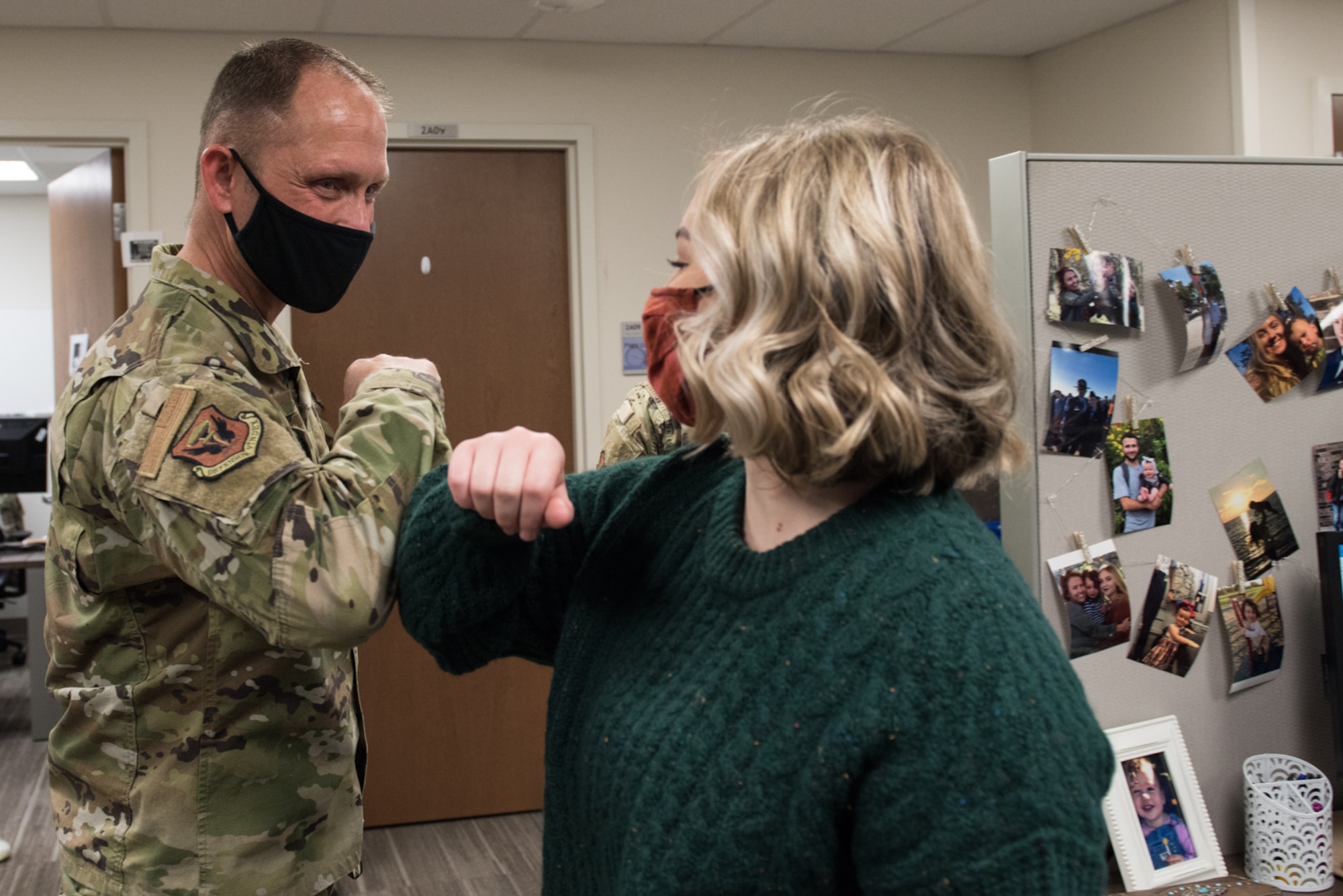 U.S. Air Force Chief Master Sgt. Jason Hodges, 509th command chief, thanks Airman Haley Moore, 509th Medical Group public health technician, for her hard work this past year at Whiteman Air Force Base, Missouri, Dec. 18, 2020. The 509th MDG created innovative ways to stay safe and healthy, in adherence to COVID-19 restrictions, from curbside pharmacy delivery to telehealth services. (U.S. Air Force photo by Airman 1st Class Christina Carter)