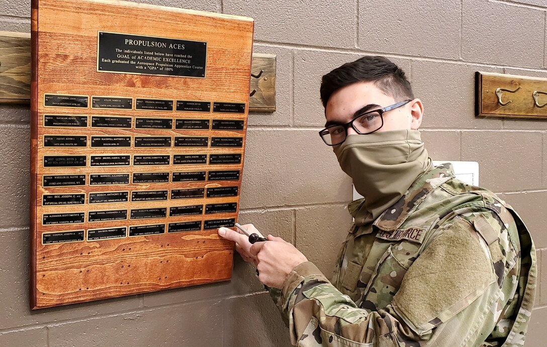 Airman Michael Bush, 361st Training Squadron aerospace propulsion course graduate, adds his name to the wall of fellow propulsion ACE award winners at Sheppard Air Force Base, Texas, Dec. 16, 2020. The ACE award is given to Airmen in Training who scored perfect scores on all their tests during Technical Training. (Courtesy Photo)