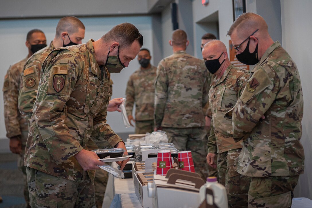 People serving breakfast.