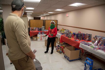Nita Ford-Hightower, Child Youth Education Services, gives a description of the types of toys service members can pick up during the School Liaison Toy Drive Dec. 17, 2020, at Joint Base San Antonio-Fort Sam Houston, Texas.