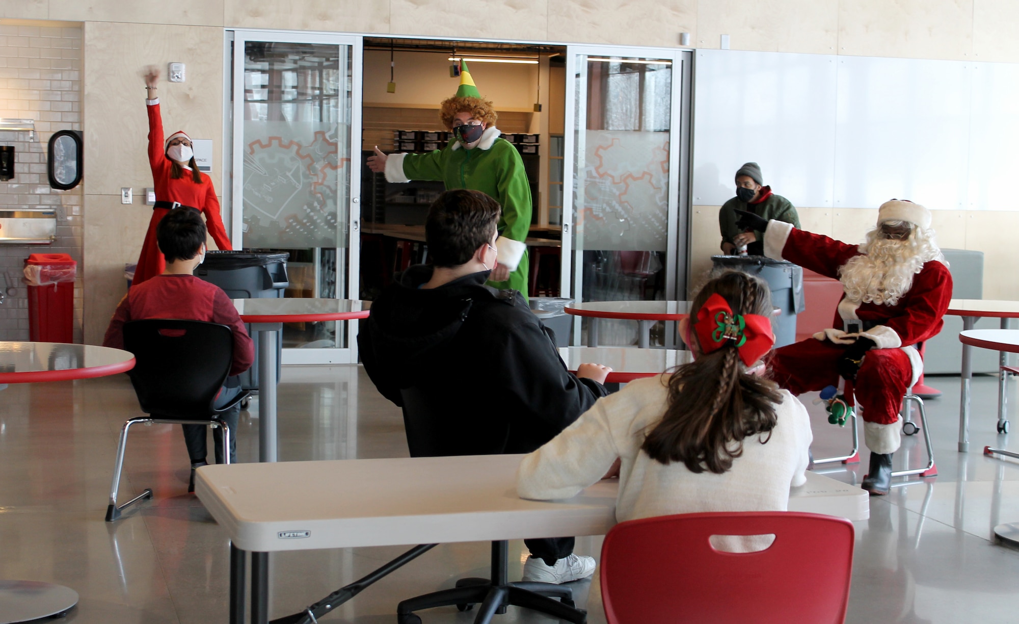 Past and present members of the wing’s 67th Aerial Port Squadron host a Christmas party Dec. 18 for students with special needs at Mound Fort Junior High in Ogden, Utah.