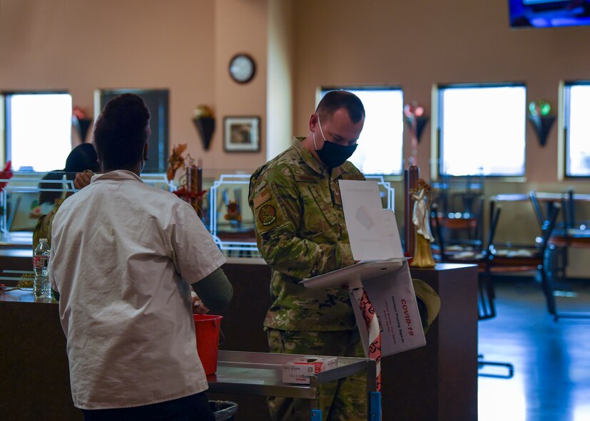 An Airman signs in at the Guardian Dining Facility on Creech Air Force Base, Nevada, Dec. 7, 2020.