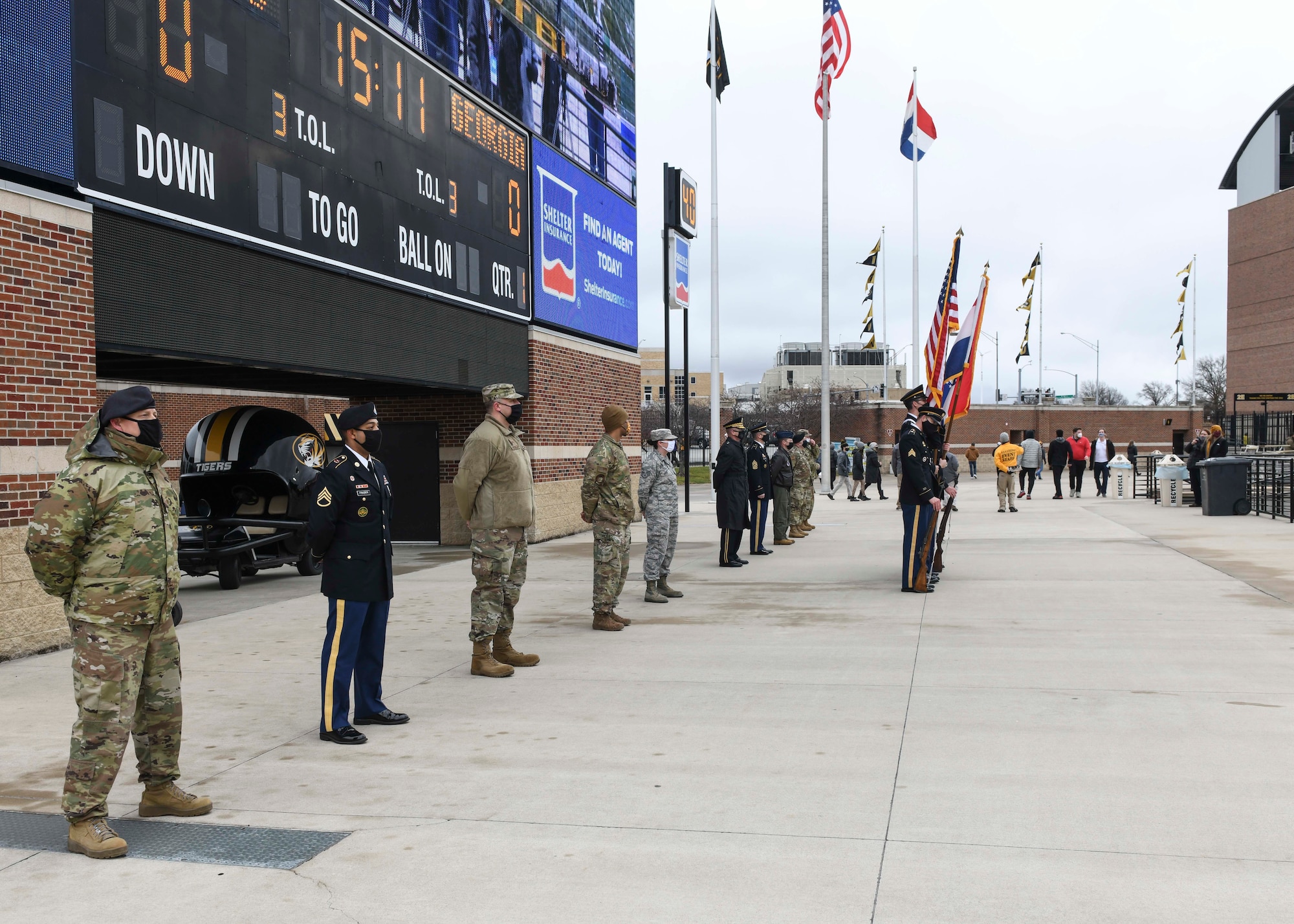 U.S. service members stand at ease prior to the Exercise Tiger Association’s annual military recognition event at Columbia, Missouri, Dec. 12, 2020. The event was held at the University of Missouri’s Faurot Field, and provided an opportunity for MIZZOU to show community support to service members. Team Whiteman received both an individual and unit award during the 22nd Annual Adopt A Warrior event. (U.S. Air Force photo by Staff Sgt. Sadie Colbert)