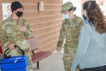 U.S. Army Spc. Drake Pugaczewski and Sgt. Kelsie McCallum deliver the COVID-19 vaccine to the Delta County Memorial Hospital, Delta, Colorado, Dec. 16, 2020. The CONG is implementing the state’s vaccination plan by transporting the vaccine to storage locations around the state and to medical care facilities administering the vaccine. (Photo courtesy Delta County Memorial Hospital)