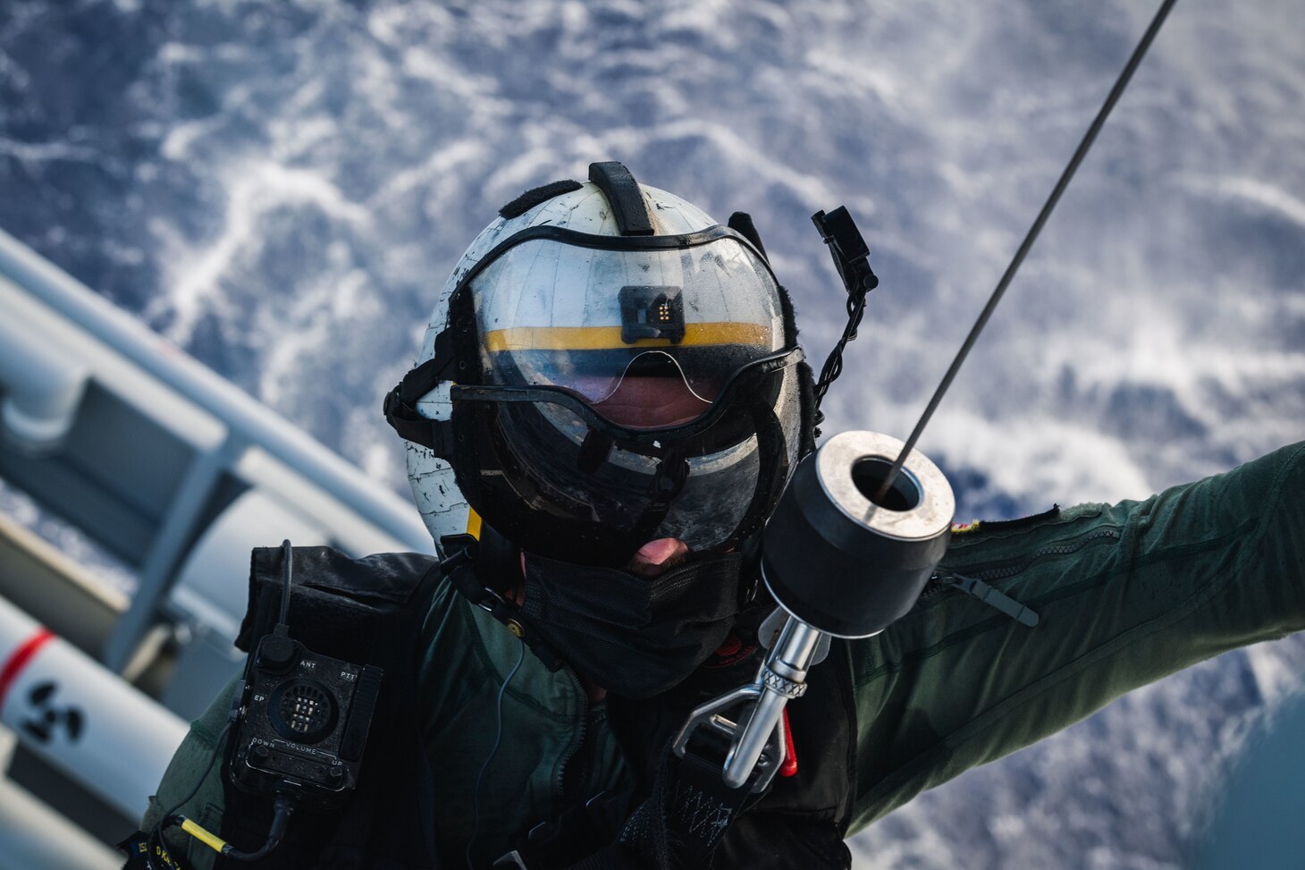 PHILIPPINE SEA (Dec. 10, 2020) Naval Air Crewman (Helicopter) 2nd Class Robert Washington, from Birmingham, Mich., assigned to the “Island Knights” of Helicopter Sea Combat Squadron 25, is hoisted during from an MH-60S Sea Hawk helicopter during a training with French Loire-class tender, and support vessel FS Seine (A 604) to ensure both nations maintain proficiency in personnel recovery while out at sea. HSC-25, the Navy’s only forward-deployed expeditionary helicopter sea combat squadron, provides a multi-mission rotary wing capability for units in the U.S. 7th Fleet area of operations and maintains a Guam-based 24-hour search and rescue and medical evacuation capability, directly supporting the U.S. Coast Guard and Joint Region Marianas. (U.S. Navy photo by Mass Communication Specialist 2nd Class Cole C. Pielop)