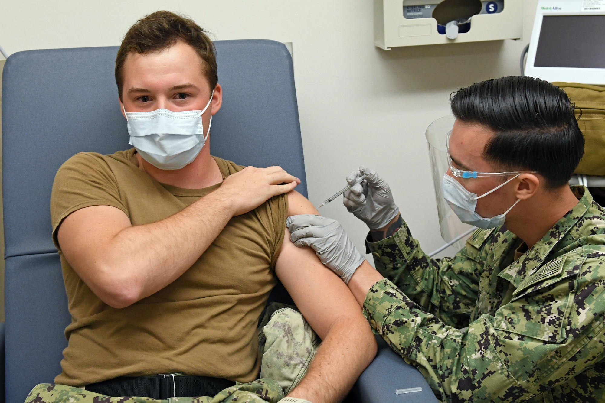Sailor receives COVID-19 vaccine.